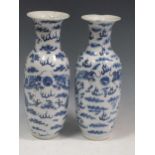 A pair of Chinese 19th century blue and white vases decorated with Fo-dogs, 31cm highStaining