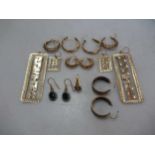 seven pairs of assessed or hallmarked as 9ct gold earrings and one single earring, tested as 9ct