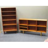 zzz A 20th century teak side cabinet on tapered legs with an open bookshelf