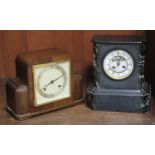 A Victorian slate mantle clock decorated with marble columns; together with an Art Deco style mantle