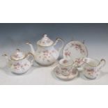 A Paragon 'Victoriana Rose' pattern part tea service, to include three teapots, cups and saucers and
