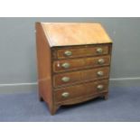 A George III and later mahogany and walnut cross banded bureau with oval reeded brass handles, 109 x