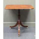 A 19th century mahogany tripod table, the rounded rectangular top with reeded edge over a turned