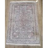 A pale ground silk rug of Persian design, 194 x 119cm