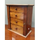 A Victorian mahogany table collector’s cabinet, of four graduated drawers, with rosewood knob