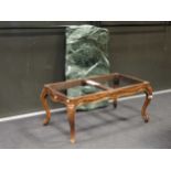 A Louis XV style marble topped beech coffee table, with floral carving raised on cabriole legs, 41 x