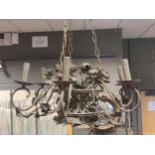 A toleware chandelier in a distressed 'mocca' colour with 6 lights60 cm diameter