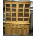 A large pine dresser with a glazed top section 246 x 188 x 54cm