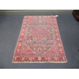 A blue ground rug with central medallion, 202 x 135cm