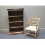 An Edwardian spindle-back elbow chair together with an early 20th century oak bookcase 125 x 76 x