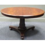 A 19th century mahogany circular breakfast table, the circular tilt-top upon a tapered and faceted