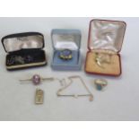 An opal doublet ring stamped '375', three brooches hallmarked or assessed as 9ct gold, a