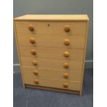 zzz A 20th century Danish blonde oak effect chest of six long drawers