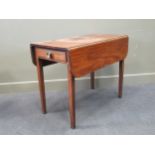 A mahogany Pembroke table, with associated embossed brass knob handle to end frieze drawer, on