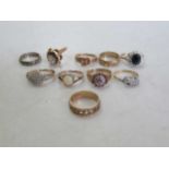 eight assorted assessed or hallmarked as 9ct gold rings, gross weight 27.3g, together with a diamond
