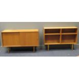 zzz A 20th century teak sideboard on tapered legs together with a teak open bookshelf on tapered leg