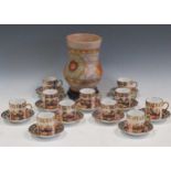 A set of 11 Royal Albert Imari coffee cans and 12 saucers; together with a Charlotte Rhead Crown