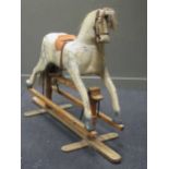 A large painted rocking horse, 119 x 175 x 62cm