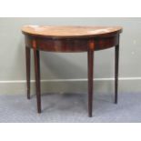 A late George III mahogany fold over top demi-lune card table on square legs 73 x 92 x 46cm (