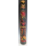 A carved and polychrome painted totem pole, probably late 19th or early 20th century, 64cm high