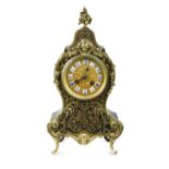 A French Louis XV style mantel clock, the Boulle brass inlaid waisted case with relief moulded