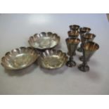 A set of six silver shot goblets together with three Irish silver ashtrays, 18.7ozt gross (9)