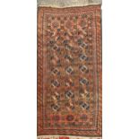 An Afghan rug 222 x 125cm