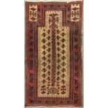 A late 19th century Belouchi prayer rug with sand coloured field166 x 89cmMultiple patches of