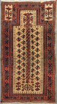 A late 19th century Belouchi prayer rug with sand coloured field166 x 89cmMultiple patches of