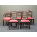A set of four George III mahogany pierced ladderback dining chairs together with a later ladder back
