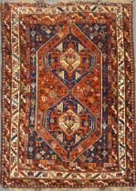 An early 20th century Qashqai carpet with a two-medallion field 157 x 195cm