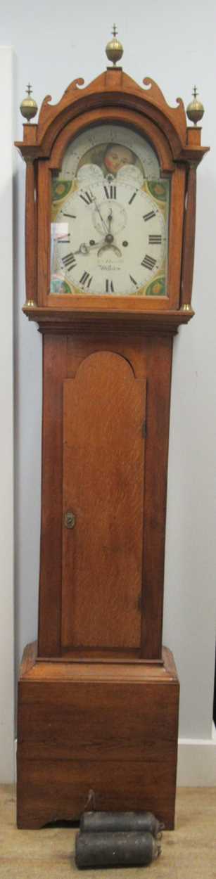 A mahogany longcase clock, with Roman chapter ring, the moon dial decorated with a lake scene and