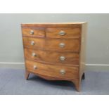 A George III mahogany bow fronted chest of two short and three long drawers, on out swept bracket