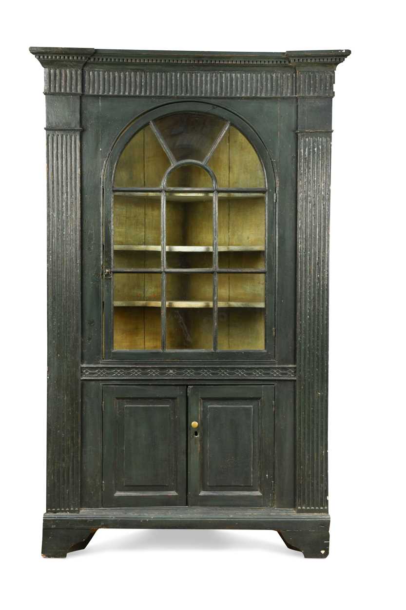 A large green painted corner cabinet, 18th century,