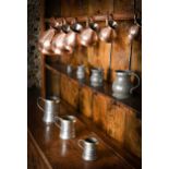 A graduated set of six copper measures, 19th century,