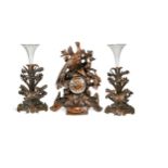 A Swiss Black Forest clock garniture, 19th century,