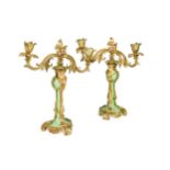 A pair of French style gilt metal and porcelain twin-branch candelabra,