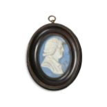 A Wedgwood blue jasperware oval portrait plaque,