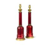 A pair of cranberry glass table lamps,