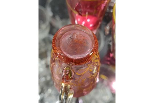 A cranberry glass and gilt cornucopia drinks dispenser with matched cranberry glass miniature - Image 9 of 21