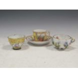 A Meissen bowl with floral encrusted decoration, together with a small tea cup and saucer, 11cm