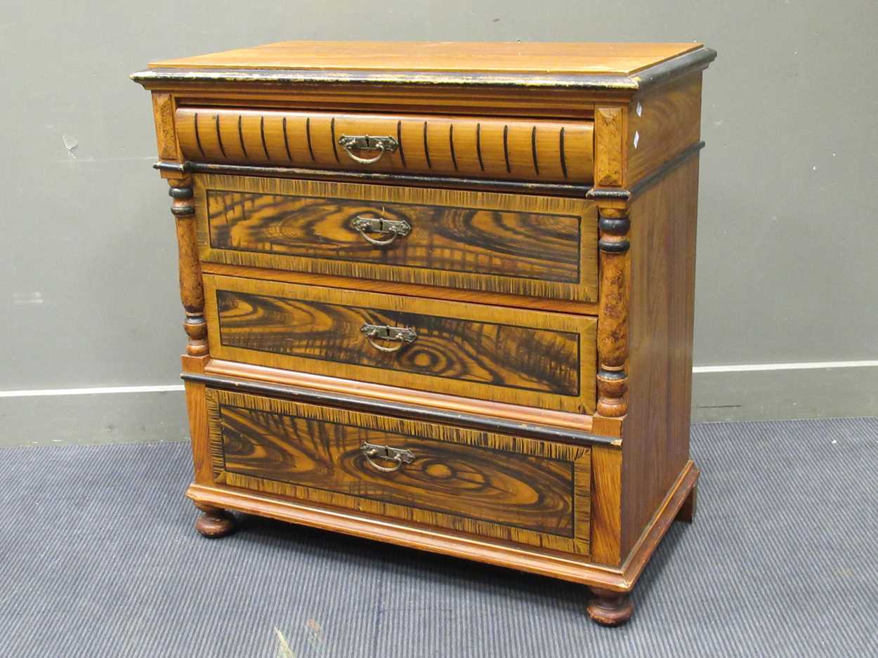 A faux painted wood grain chest of drawers, comprising of four long drawers flanked by split