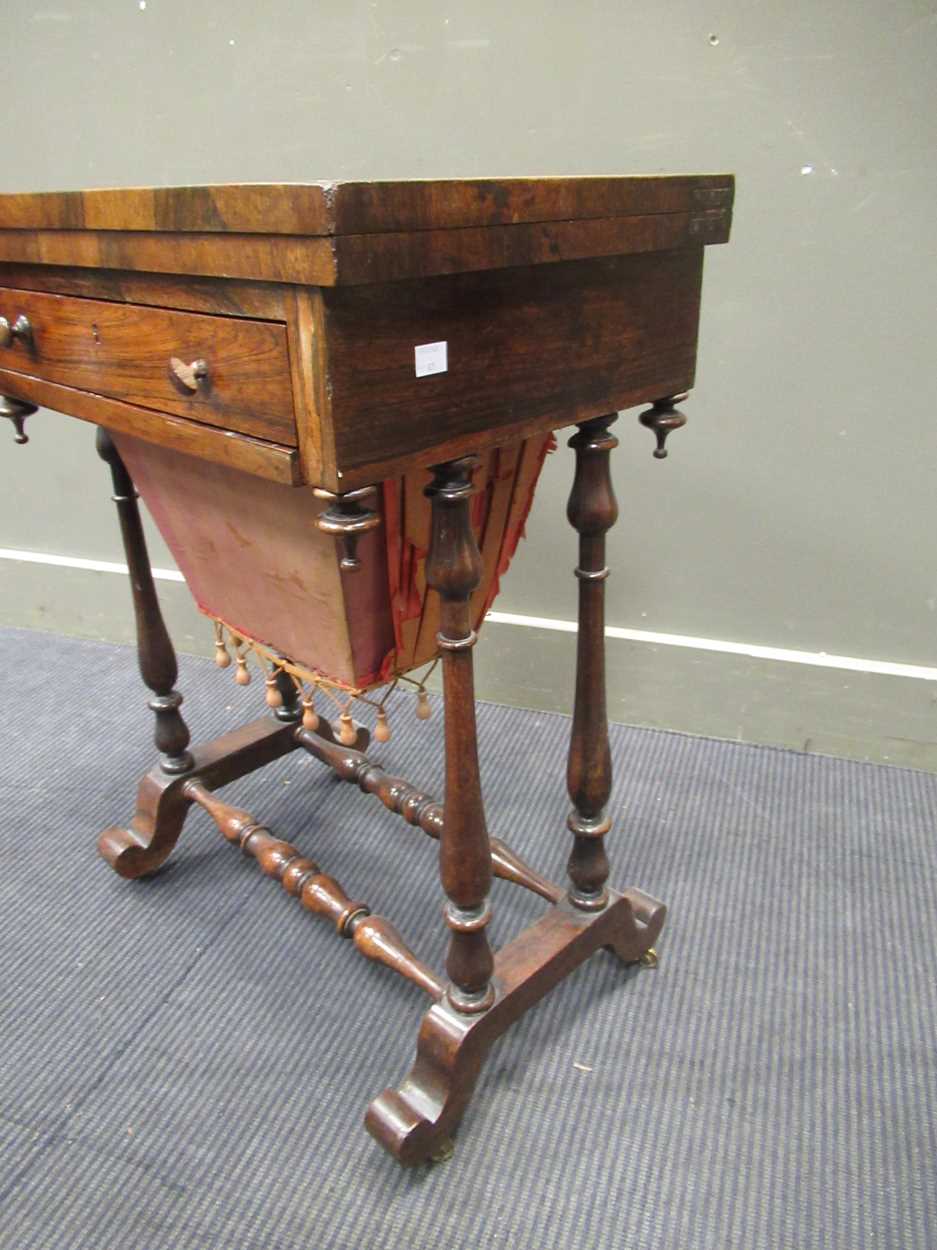 A 19th century inlaid rosewood games table, the fold over swivel top enclosing an inlaid - Image 8 of 10