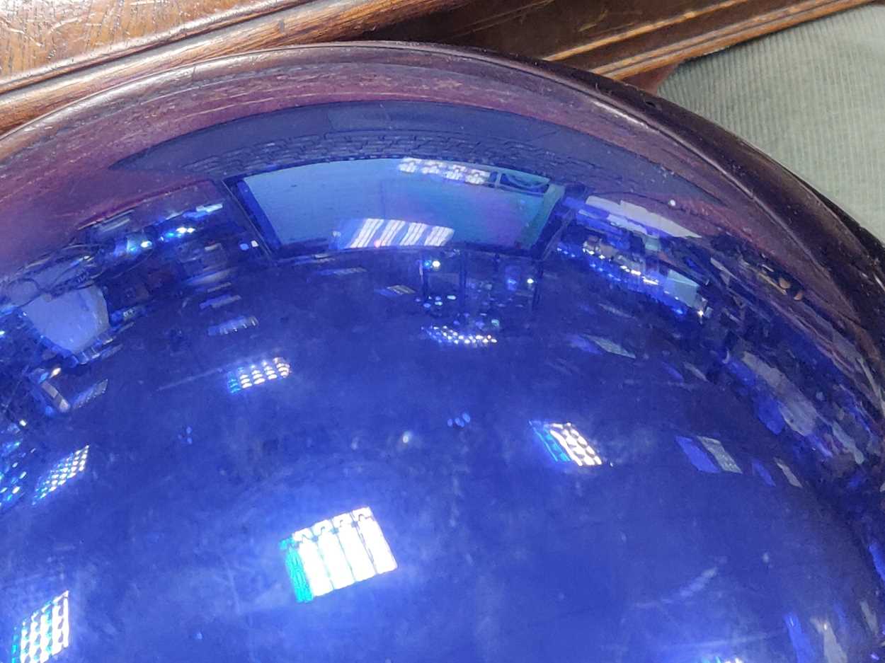 A large late 19th or early 20th century blue glass Witch's ball, approx 30cm diameterSome movement - Image 6 of 10