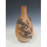 A 19th/20th century Japanese brown-glazed stoneware bottle vase decorated with two applied