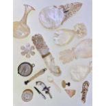 A collection of mother of pearl items including caddy spoons, vinaigrette, jewellery etc
