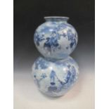 Japanese blue and white porcelain vase, late 19th century, decorated with a scholar's processions,