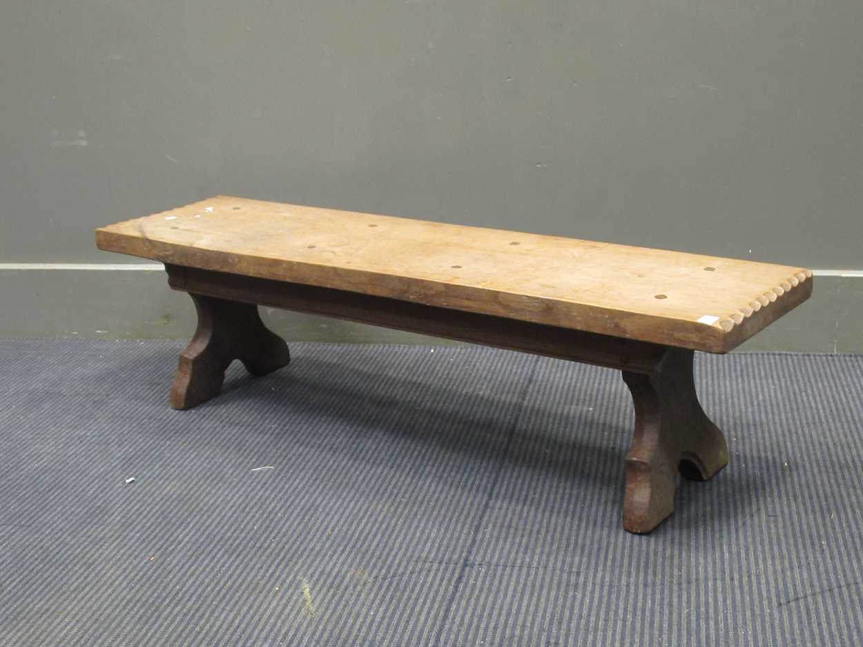 A Jack Grimble Cromer oak stool, the rectangular stool with chip carved