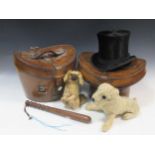 A 20th century hard wood truncheon, 39cm long; together with a Chiltern toy dog and another