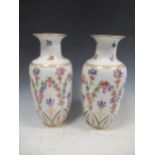 A pair of Dresden vases, decorated with flowers, 31cm high